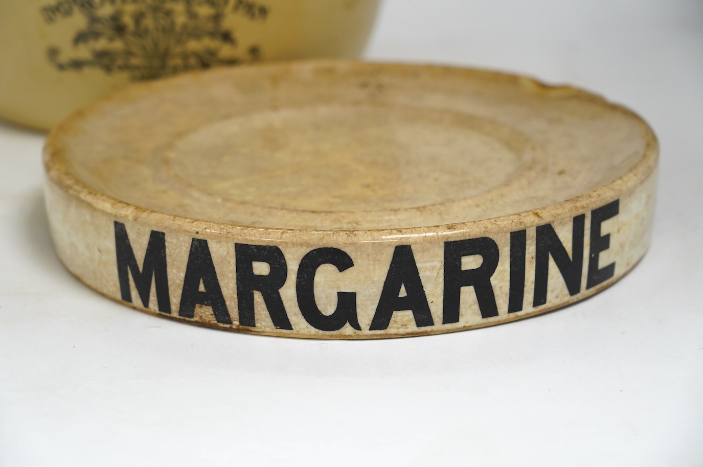 A Victorian Doulton Lambeth Improved Bread Pan, 32cm high, together with a Victorian pottery circular Margarine stand, 30cm diameter. Condition - poor to fair